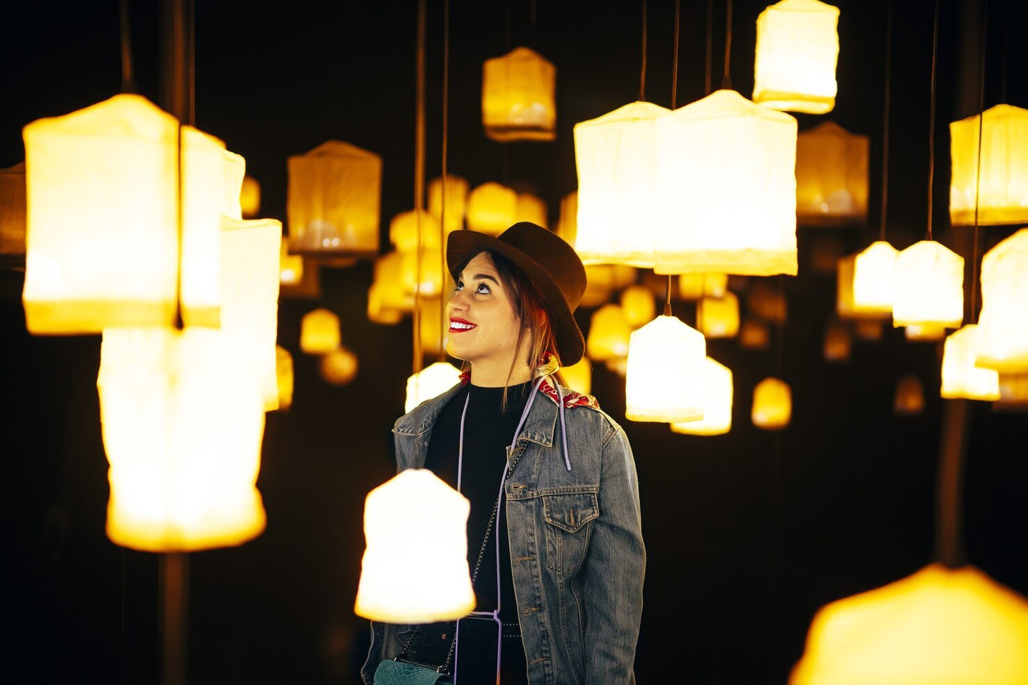 closeup shot happy young lady room with many bright chandeliers 181624 44491